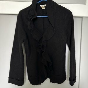 This is a decorative 100 % wool jacket with flowers.